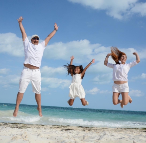 Image of Dr. and their family enjoying the beach outside of the dental practice