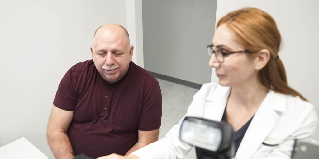 patient and Doctor discussing on dental implant procedure