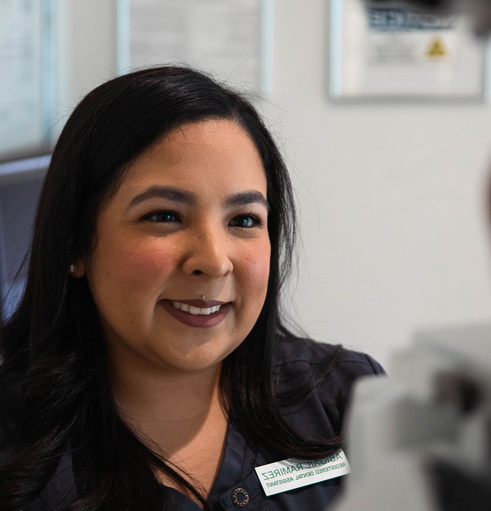 staff member helping patient with scanning for procedure